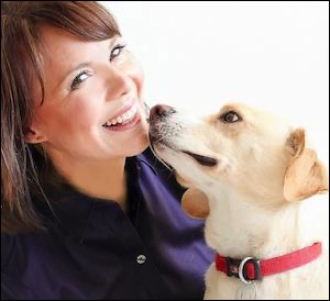 Woman smiling with white dog