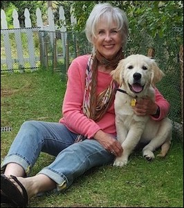 Woman with Golden Retriever puppy