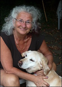 Smiling woman with golden lab