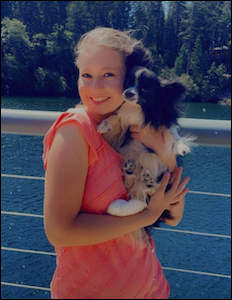 woman with small black and white dog